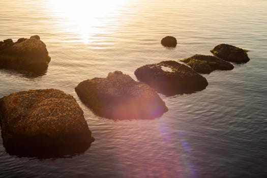 Rock on the sea at sunset in Ortigia, Syracuse