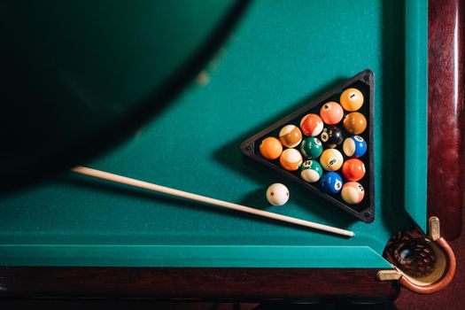 Billiard table with green surface and balls in the billiard club.Pool Game.