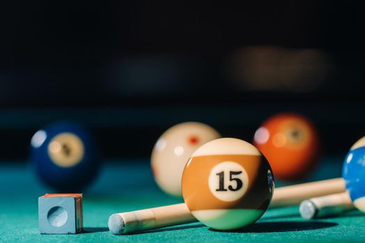Billiard table with green surface and balls in the billiard club.Pool Game.