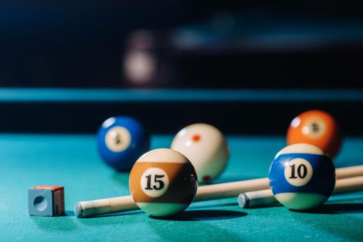 Billiard table with green surface and balls in the billiard club.Pool Game.