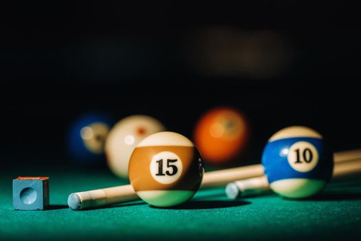 Billiard table with green surface and balls in the billiard club.Pool Game.