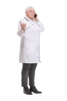 Portrait of middle aged female doctor talking with somebody on her mobile phone. Concept of healthcare worker.