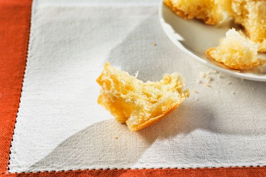 Small cake crumb on white cloth , ready to eat