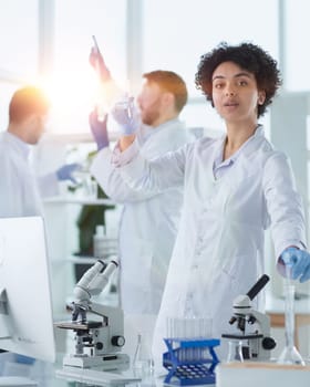 Scientists smiling together in lab