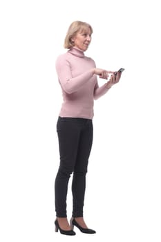 Side view of a casual woman texting on her phone, isolated on a white background