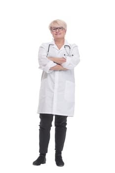 in full growth. competent doctor in a white coat. isolated on a white background.