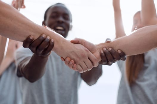 confident group of young men pointing ahead. photo with copy space