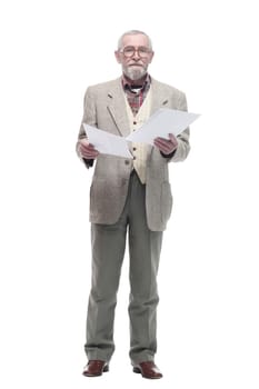 in full growth. smiling elderly man reading a business document. isolated on a white background.