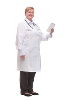 Side view of professional doctor or nurse woman in labcoat uniform with stethoscope on neck and check tablet smiles in studio white background