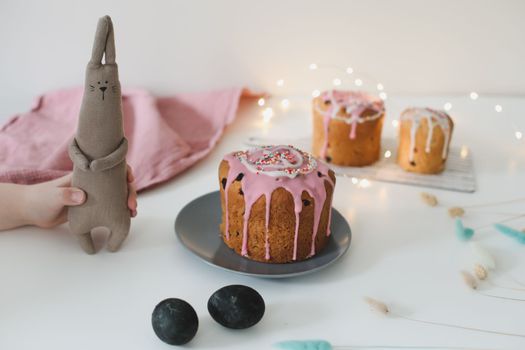 Easter cake, colorful eggs and rabbit toy. Happy Easter holiday concept. festive spring season.