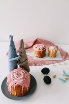 Easter cake, colorful eggs and rabbit toy. Happy Easter holiday concept. festive spring season.