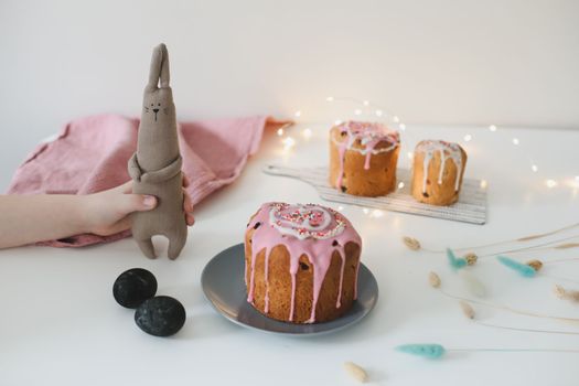 Easter cake, colorful eggs and rabbit toy. Happy Easter holiday concept. festive spring season.