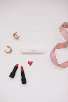 Cosmetic makeup products and accessories flatlay top view. Concept Women's Day, Valentines Day, March 8.