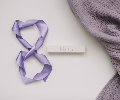 Eight made of violet ribbon. 8 March greeting card template. International Women's day background, banner, poster or brochure.