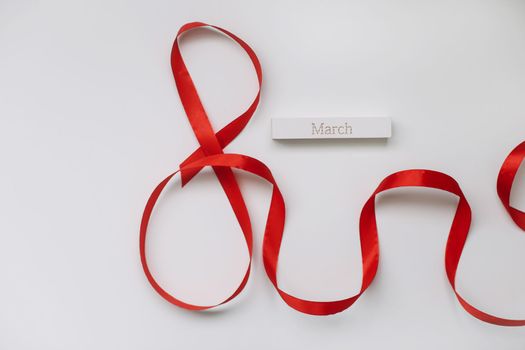 Eight made of red ribbon. 8 March greeting card template. International Women's day background, banner, poster
