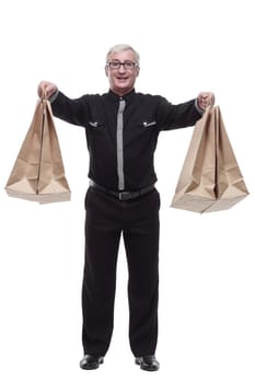 in full growth. happy casual man with shopping bags. isolated on a white background.