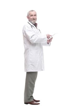 elderly competent doctor with a digital tablet. isolated on a white background.