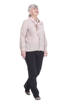 in full growth. confident old lady striding forward. isolated on a white background.