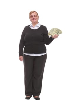 Front view of senior brunette businesswoman in black suit holding money isolated on white