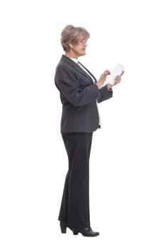 Smiling business woman in black suit with tablet computer. Isolated over white background