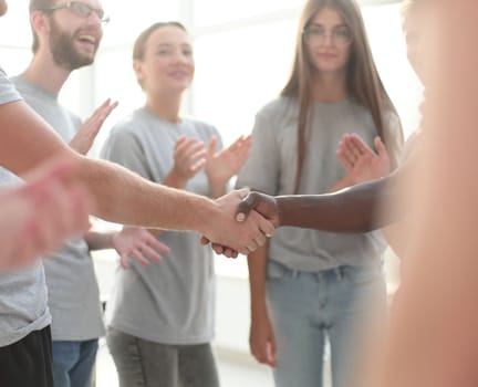 close up. contact group leaders shake hands. the concept of unity
