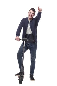 smiling young man with an electric scooter . isolated on a white background.