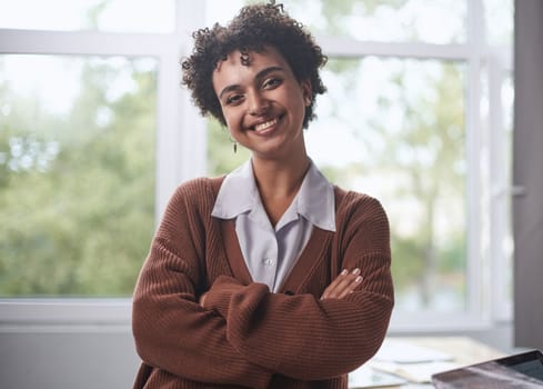 Young mixed race businesswoman smiling to camera