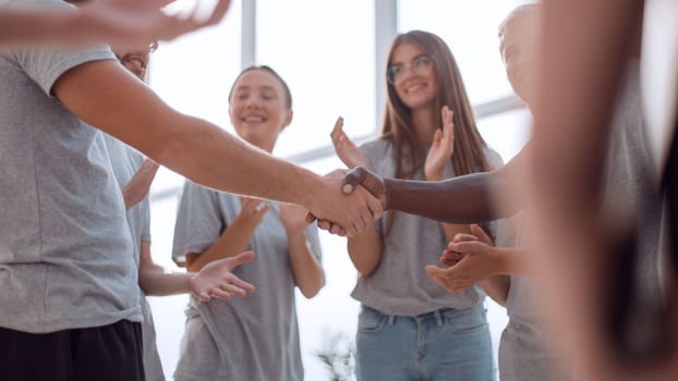 close up. contact group leaders shake hands. the concept of unity