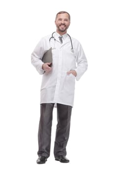 in full growth. smiling doctor with clipboard . isolated on a white background.