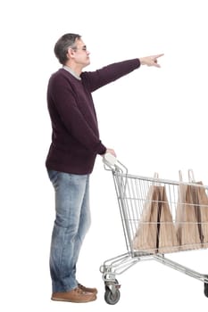 full-length. casual man with shopping cart. isolated on a white background.