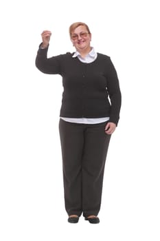 Front view of friendly caucasian smiling woman holding keys and looking at camera