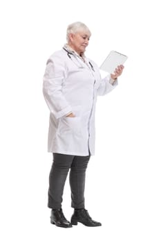 Portrait of woman doctor holding tablet computer, looking at camera, smiling. Concept of medical consultation online