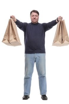 in full growth. Mature man in jeans striding forward.isolated on a white background.