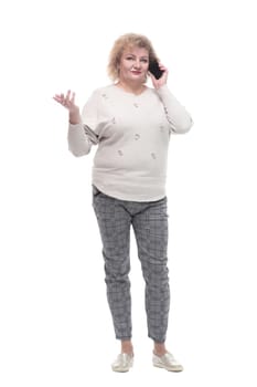 in full growth. attractive adult woman with a smartphone. isolated on a white background.