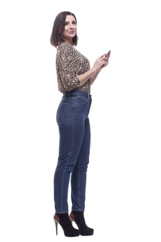 in full growth. attractive young woman with a smartphone. isolated on a white background.