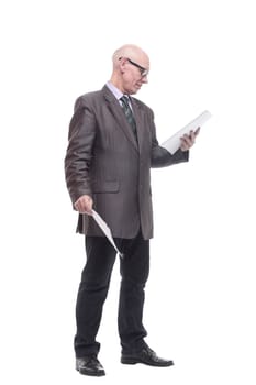 in full growth. business man with a stack of documents. isolated on a white background