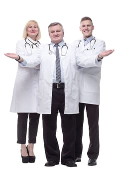 in full growth.qualified doctors colleagues standing together. isolated on a white background.