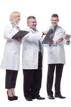 in full growth.qualified doctors colleagues standing together. isolated on a white background.