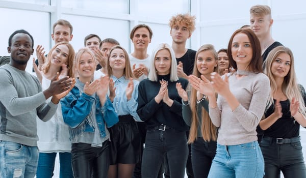 group of young people applauding . the concept of success.