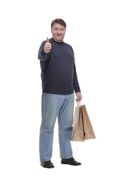 in full growth. mature man with shopping bag.isolated on a white background.