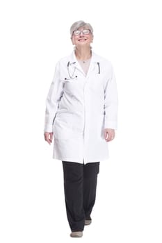 in full growth. happy woman doctor striding forward. isolated on a white background.