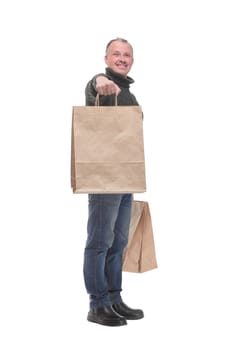 Full isolated studio picture from a man with shopping bags looking at camera