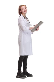 Side view of female doctor filling up medical form on clipboard. Healthcare, insurance and medicine concept