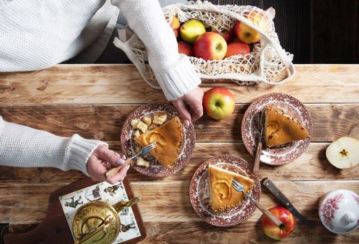 woman tasting a piece of apple pie, thanksgiving still life top view, High quality photo