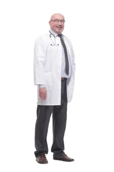 in full growth. successful mature doctor in a white coat .isolated on a white background