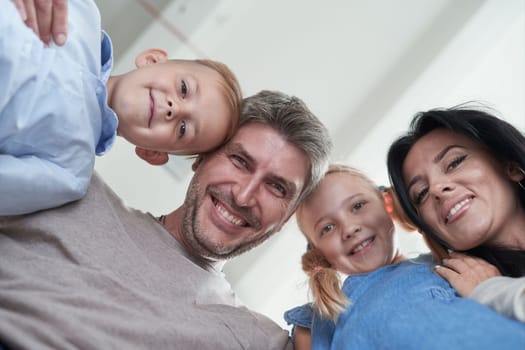 happy family mother father and children at home