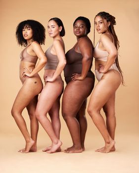 Body positivity, skin and portrait of women group together for inclusion, beauty and power. Aesthetic model friends on beige background with underwear cellulite, pride and motivation for self love.