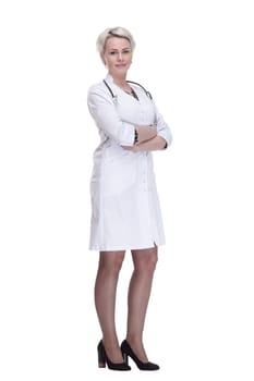 in full growth. young woman doctor looking at you . isolated on a white background.