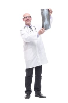 senior doctor with a stethoscope looking at an x-ray. isolated on a white background.