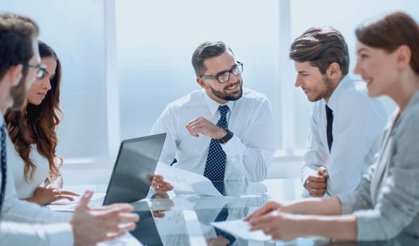 Frustrated business people sitting at the table in office.business concept